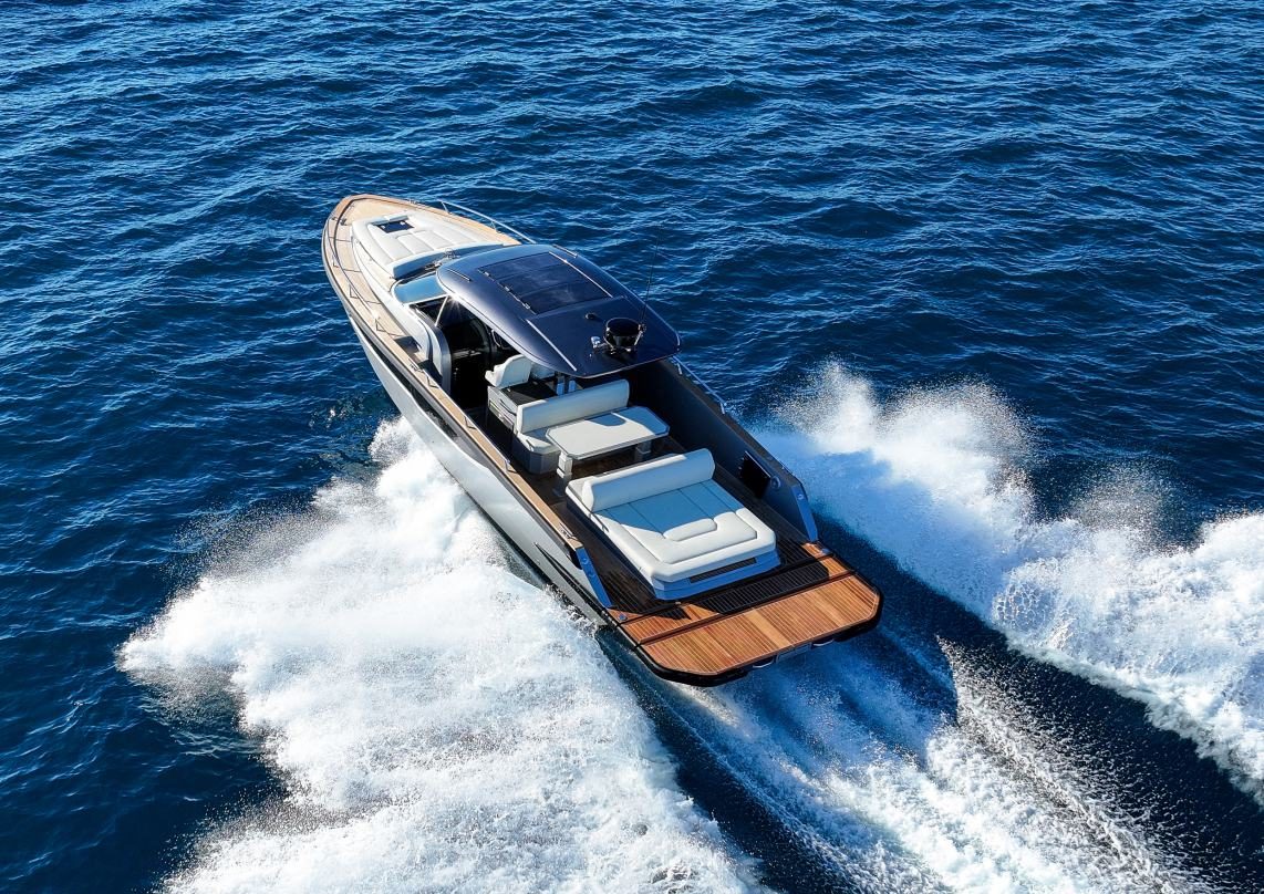 Silver Forza 37 from astern showing teak swim platform